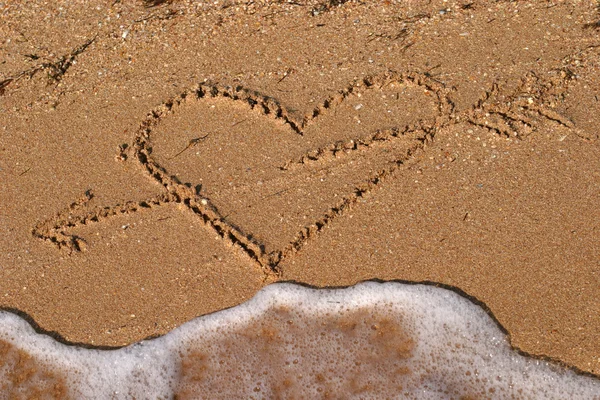 Hart vorm foto op het strand — Stockfoto