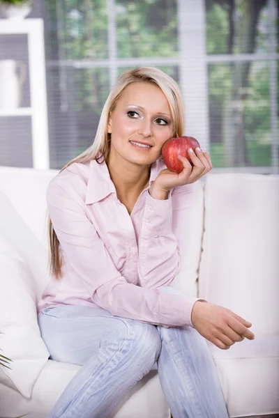 Woman with an apple — Stock Photo, Image