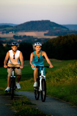 Biking couple clipart