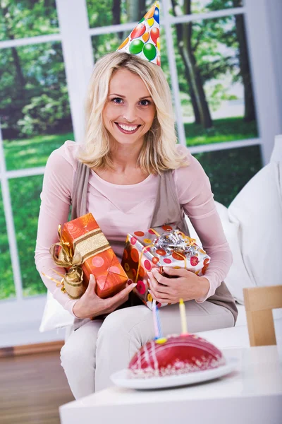 Young woman with gifts — Stock Photo, Image