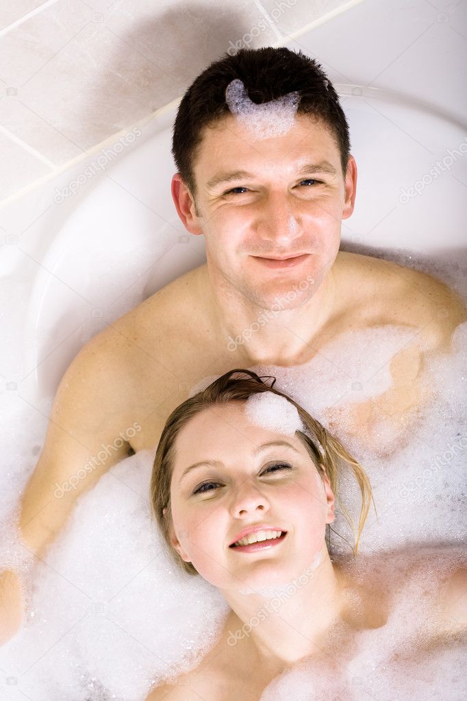 Couple relaxing in the bathtub