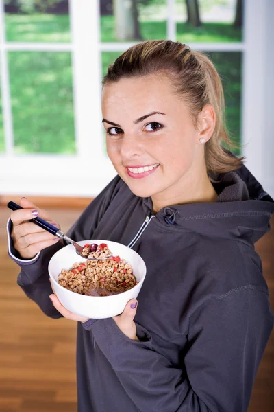 Woman with muesli bowl — Stock Photo, Image