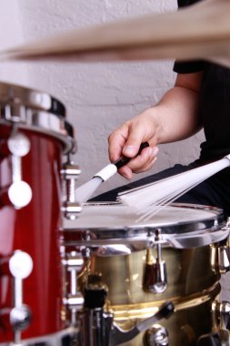 Drummer playing drums clipart