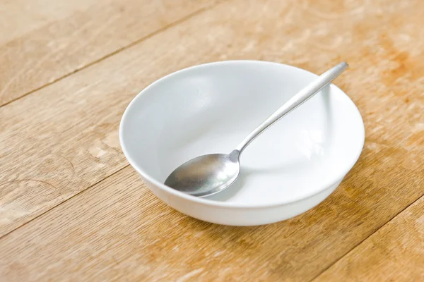 Breakfast bowl and spoon — Stock Photo, Image