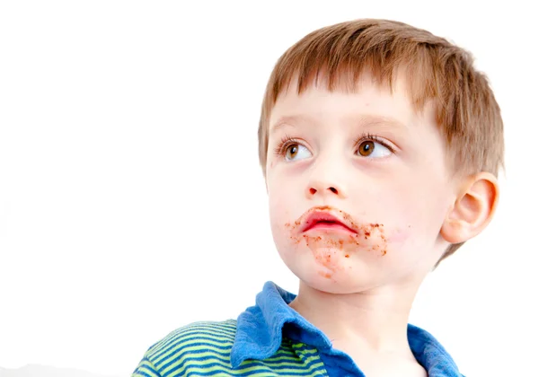 Toddler eating chocolate — Stock Photo, Image