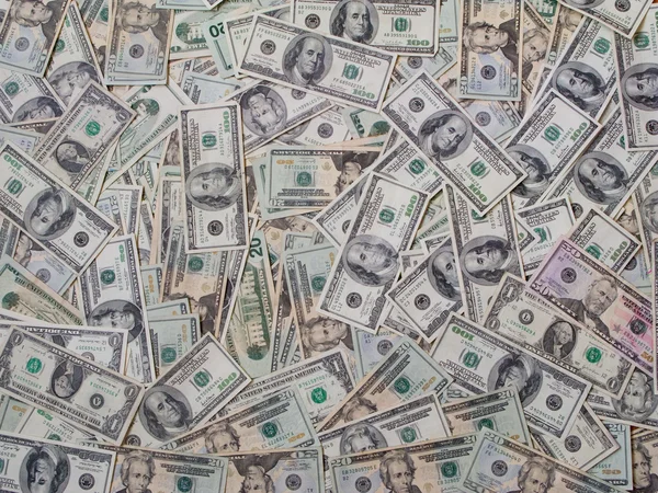 Dollar bills piled — Stock Photo, Image
