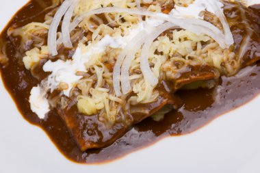 Mole enchiladas close-up clipart