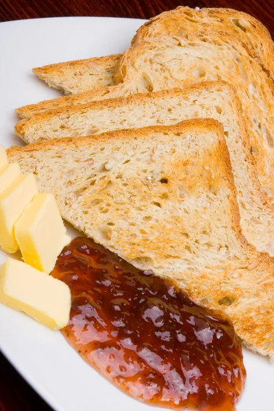 Bread, marmalade and butter, vertical. — Stock Photo, Image