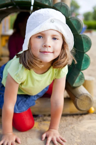 Girl playing on children's playground — Stock Photo, Image