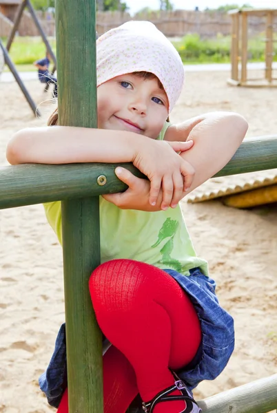 Girl playing on children playground — Stock Photo, Image