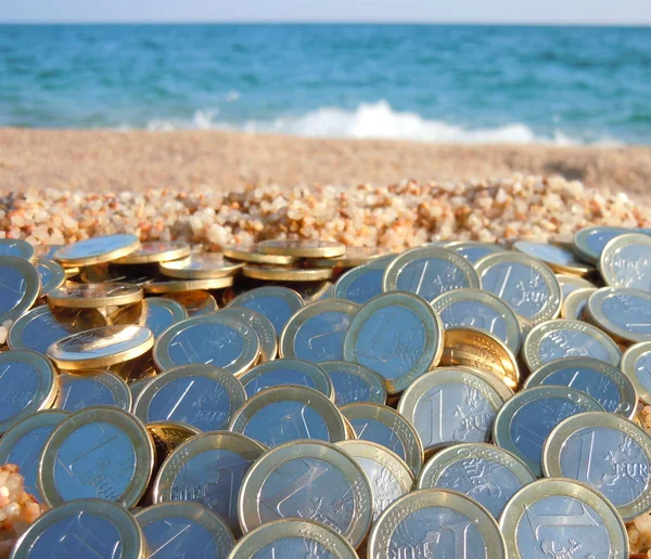As many euros as sand grains at the beach — Stock Photo, Image