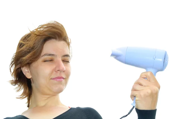 Mulher segurando secador de cabelo — Fotografia de Stock