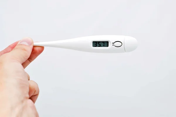 stock image Electronic thermometer in the hand