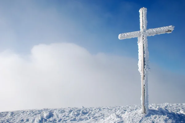 stock image Cross on the mountain peak