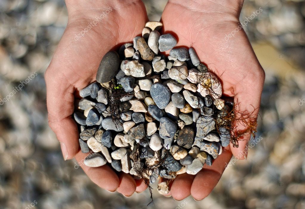 Many small stones in hands stock photo 6703624 from Depositphotos collectio...