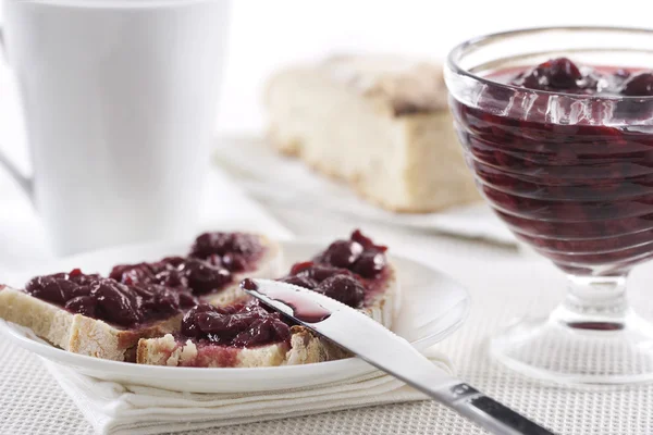 Cherry jam on toast — Stock Photo, Image