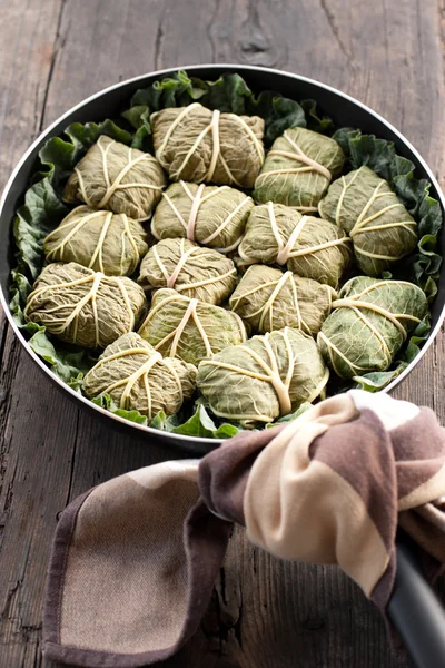 Dolmades with rhubarb leaves, meat and rice — Stock Photo, Image