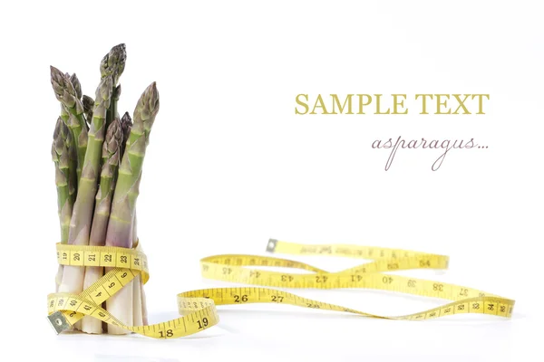 Asparagus and measuring type — Stock Photo, Image