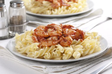 Pasta with tomato and prawns clipart