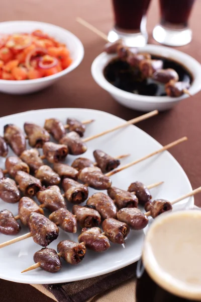 stock image Grilled chicken hearts on skewers