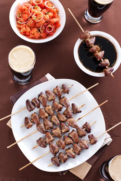 stock image Grilled chicken hearts on skewers