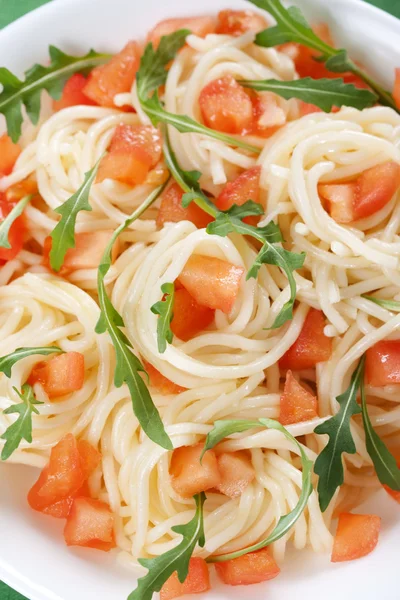 Pasta with tomato and rucola — Stock Photo, Image