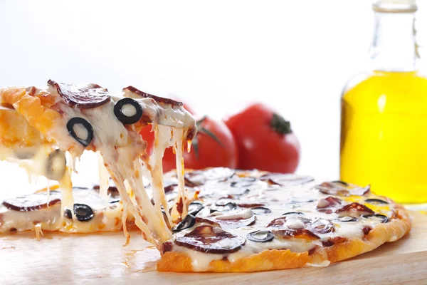 Pizza with melted cheese — Stock Photo, Image
