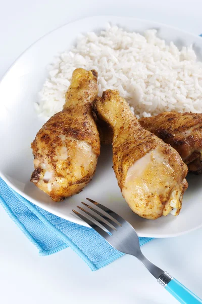Roasted chicken legs with boiled rice — Stock Photo, Image