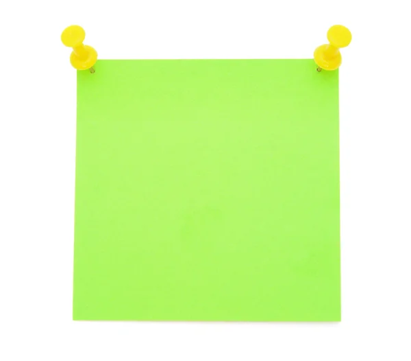 Green post-it note with yellow pushpins — Stock Photo, Image