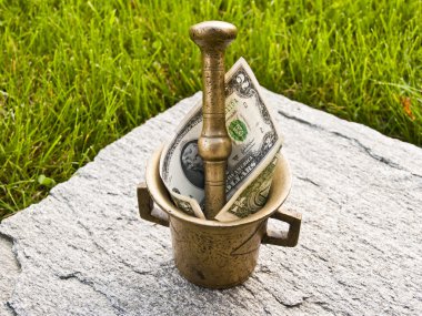 Mortar with dollar of green grass and stone clipart