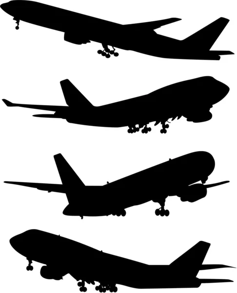 Flugzeugsilhouetten — Stockvektor