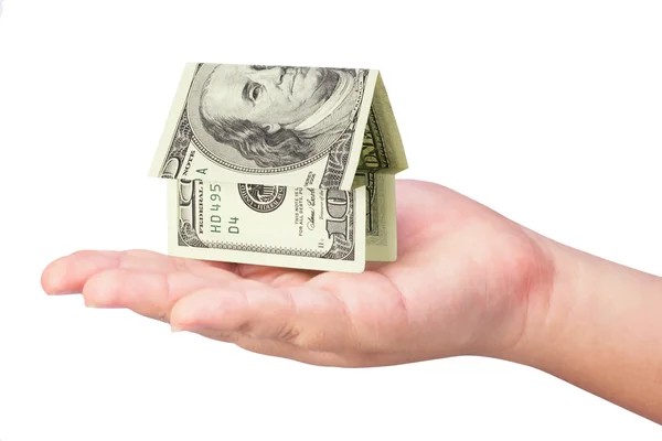 Kid's hand holdling money house — Stock Photo, Image