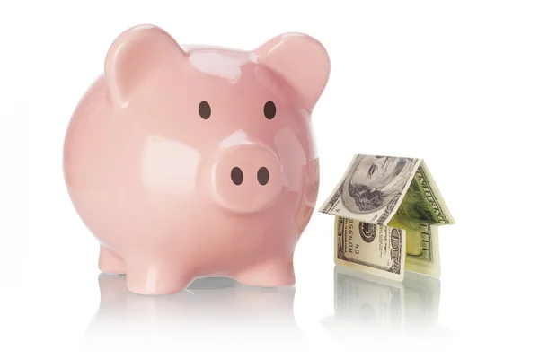 Piggy bank en geld huis — Stockfoto