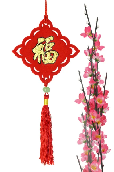 Chinese New Year traditional ornament and plum blossom — Stock Photo, Image