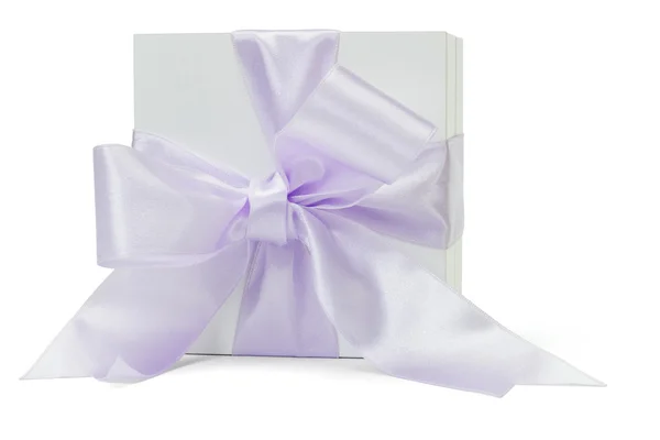 Gift box with large purple ribbon — Stock Photo, Image