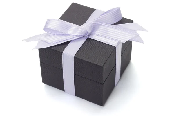 Black gift box with bow ribbon — Stock Photo, Image