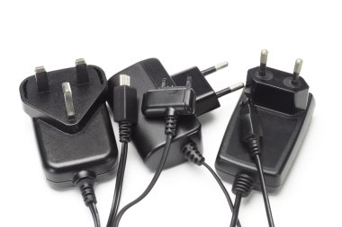 Assorted mobile phone chargers and adapters clipart