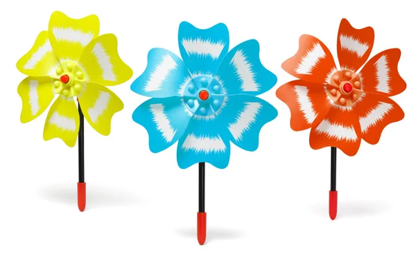 Trzy kolorowe zabawki wiatraki — Zdjęcie stockowe