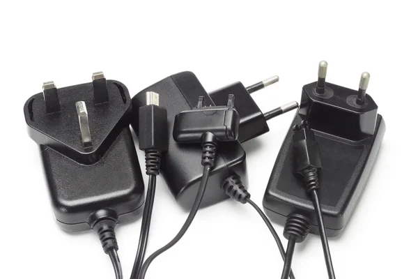 Assorted mobile phone chargers and adapters — Stock Photo, Image