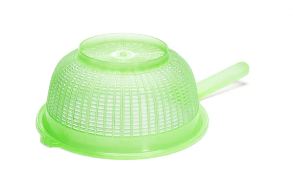 Green plastic kitchen strainer — Stock Photo, Image