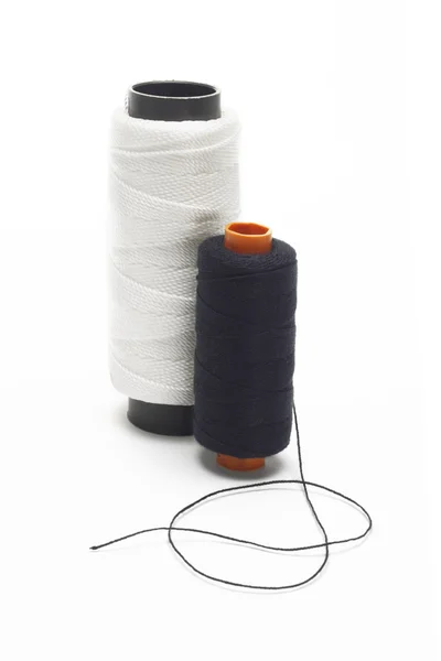 Black and white bobbins of threads — Stock Photo, Image