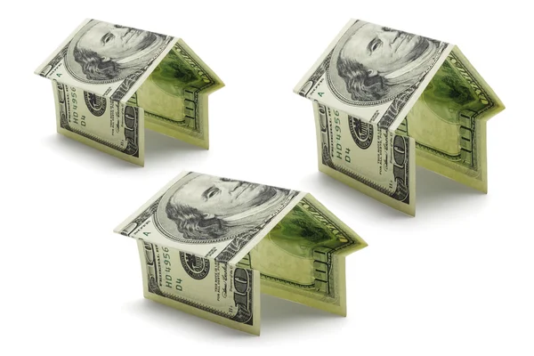 Hundred dollars US notes in shapes of houses — Stock Photo, Image