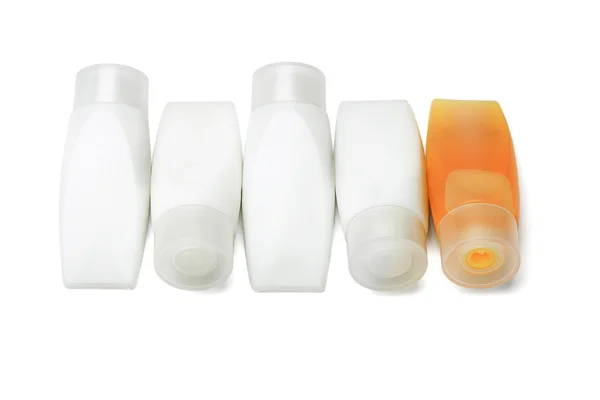 Plastové trubky, sprchový gel a šampon — Stock fotografie