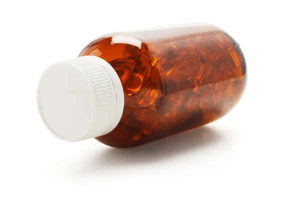 Capsules in glass bottle — Stock Photo, Image