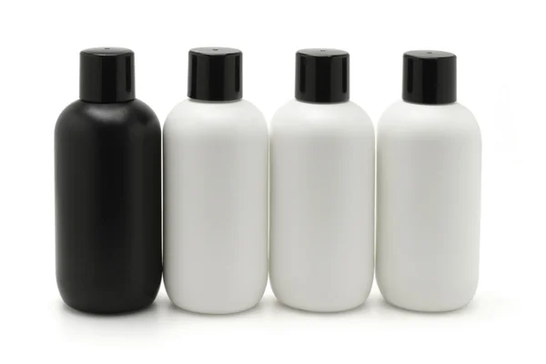 Black and white cosmetic containers — Stock Photo, Image