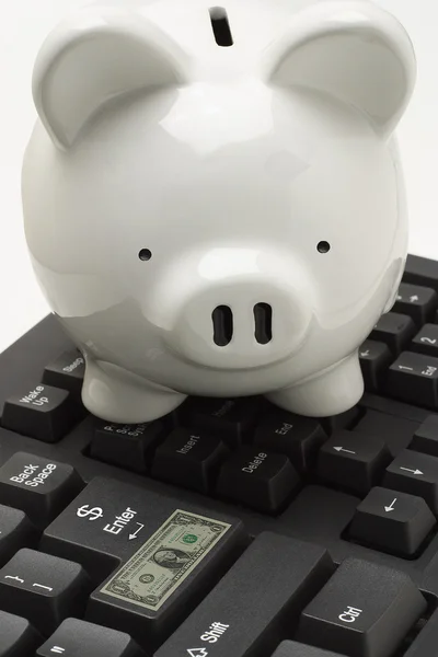 Piggybank on computer keyboard — Stock Photo, Image