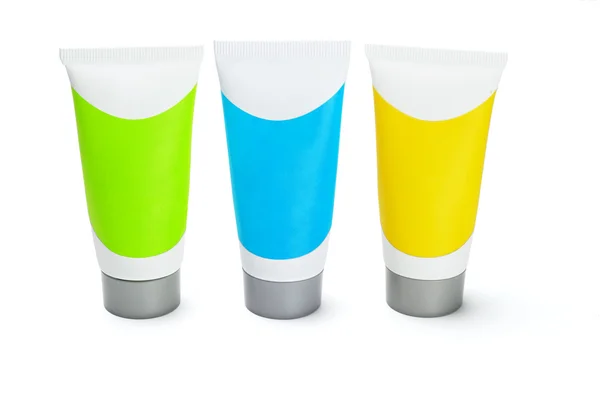 Three colorful cosmetic tubes — Stock Photo, Image