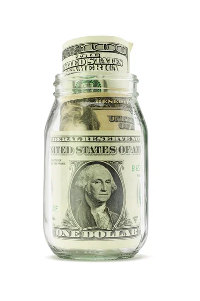 Доллары США в стеклянной банке — стоковое фото
