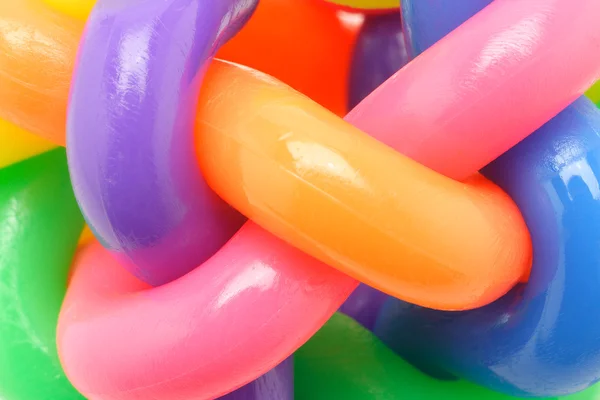 Imagem macro de anéis de borracha multicoloridos interligados — Fotografia de Stock