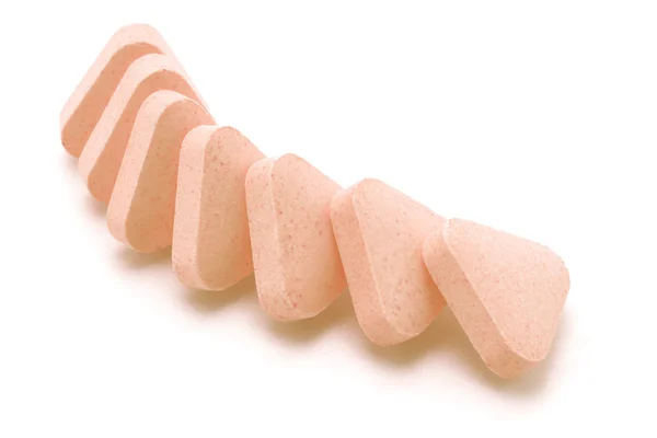 Triangular shape vitamin tablets — Stock Photo, Image